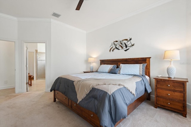 bedroom featuring crown molding, light colored carpet, ceiling fan, and ensuite bathroom