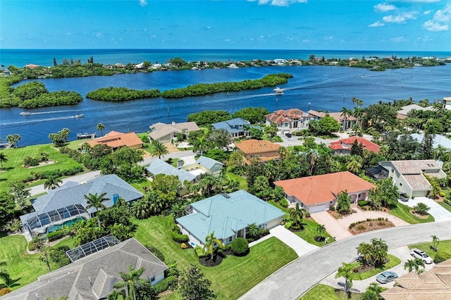 birds eye view of property with a water view