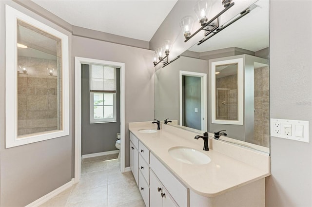 bathroom featuring toilet, tile patterned floors, and vanity