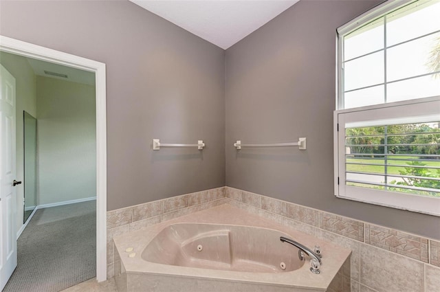 bathroom with tiled tub