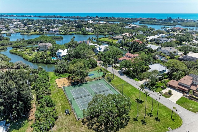 birds eye view of property with a water view