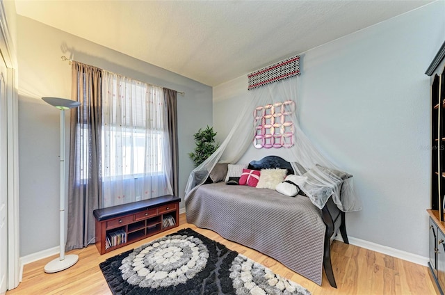 bedroom featuring hardwood / wood-style floors