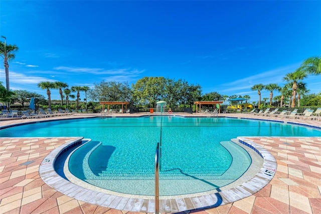 view of swimming pool featuring a pergola