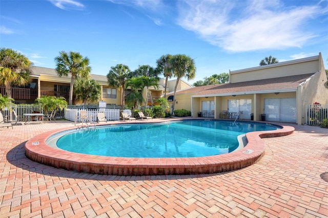 view of swimming pool with a patio area