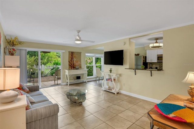 tiled living room featuring ceiling fan and ornamental molding