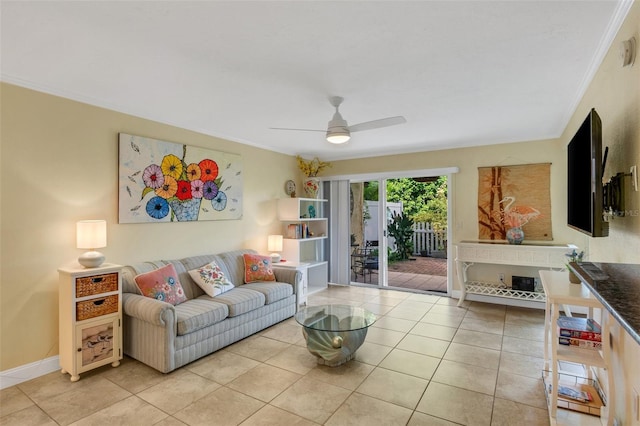 tiled living room with crown molding and ceiling fan