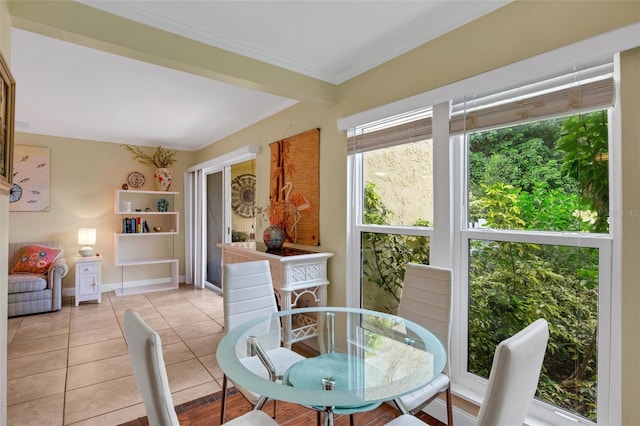 dining space featuring light tile patterned floors and plenty of natural light