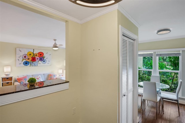 hall with crown molding and hardwood / wood-style floors