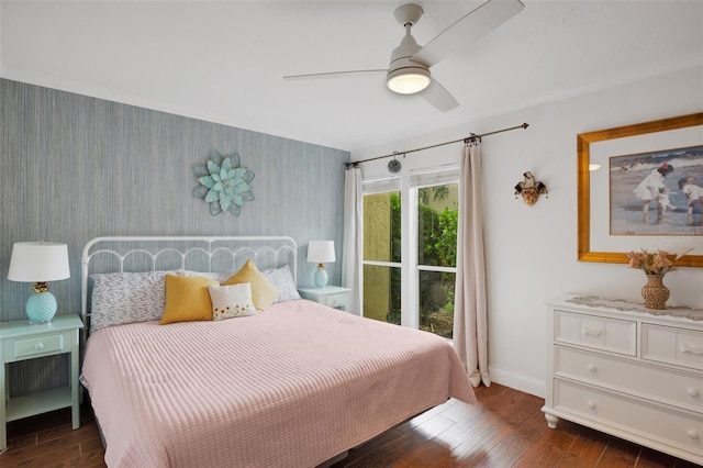 bedroom with crown molding, dark hardwood / wood-style flooring, and ceiling fan