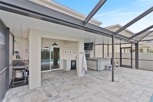 view of patio / terrace with glass enclosure and a fenced in pool