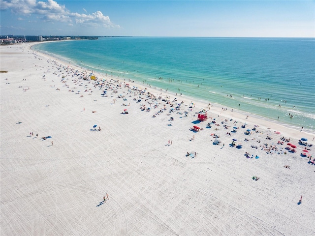 birds eye view of property featuring a water view and a view of the beach