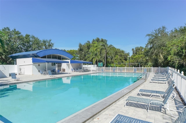 view of swimming pool featuring a patio area