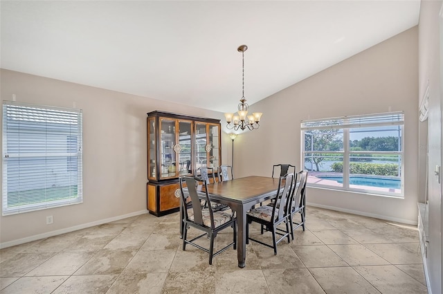 dining space featuring a chandelier and lofted ceiling