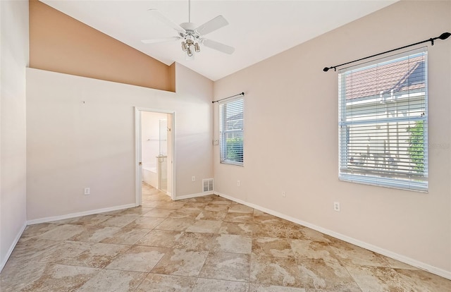 spare room featuring vaulted ceiling and ceiling fan