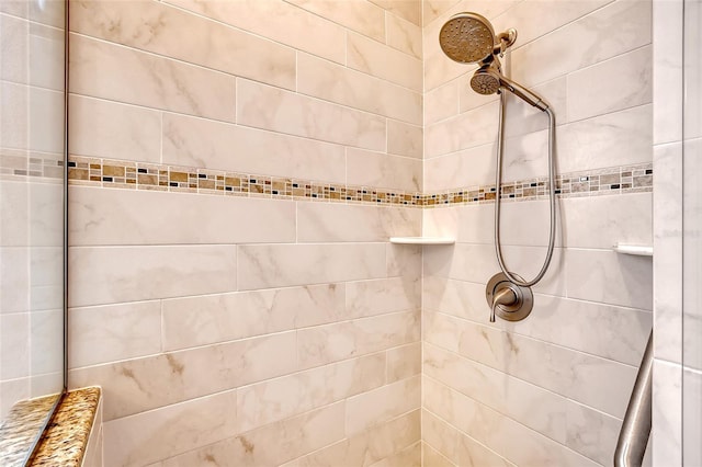 bathroom with a tile shower