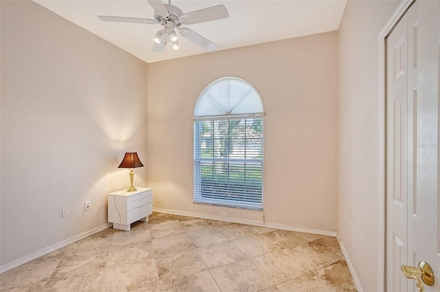 spare room with ceiling fan