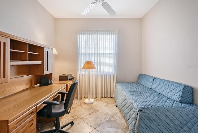 tiled home office featuring ceiling fan