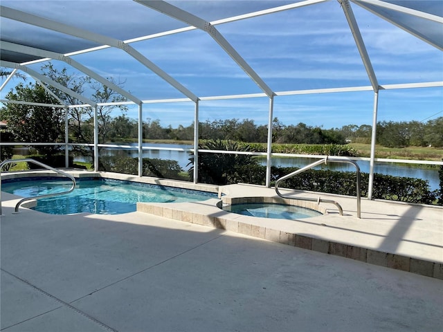 view of swimming pool featuring a lanai, a water view, and an in ground hot tub