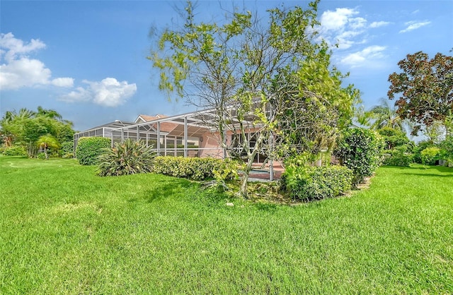 view of yard with a lanai