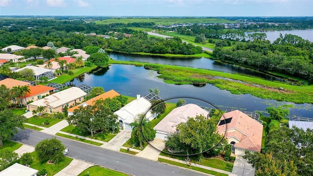 birds eye view of property featuring a water view