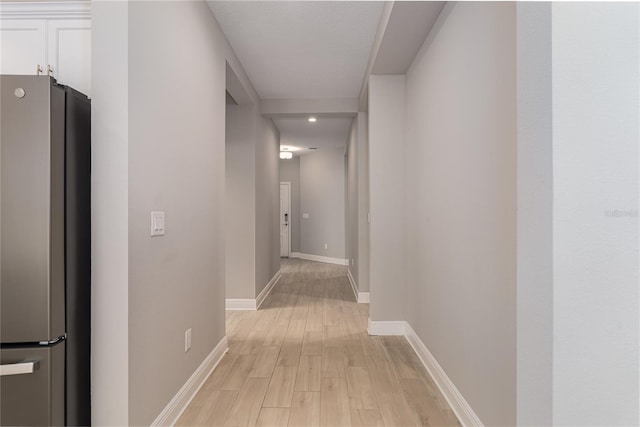 hallway featuring light hardwood / wood-style flooring