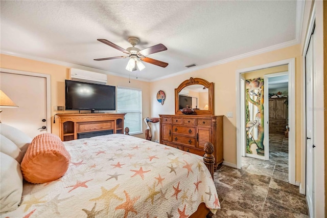 bedroom featuring ceiling fan, a textured ceiling, ornamental molding, and an AC wall unit