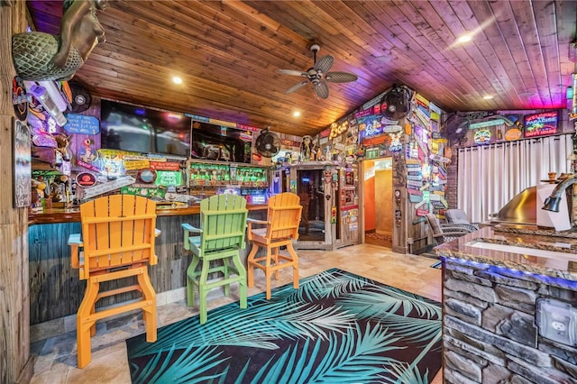 playroom with lofted ceiling, ceiling fan, a dry bar, and wood ceiling