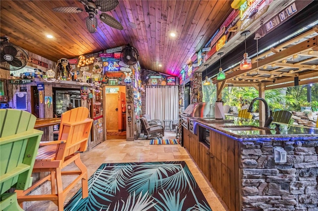 bar with wood ceiling, vaulted ceiling, black microwave, ceiling fan, and sink