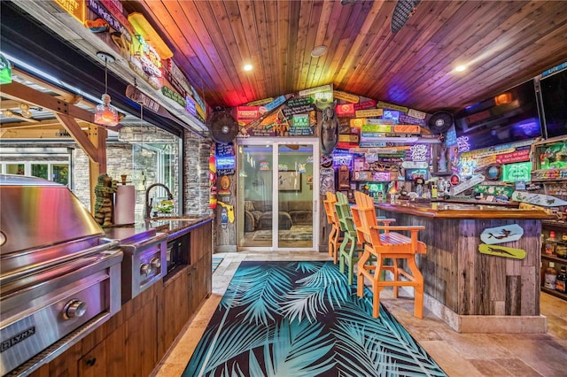 bar with vaulted ceiling, wooden ceiling, and sink