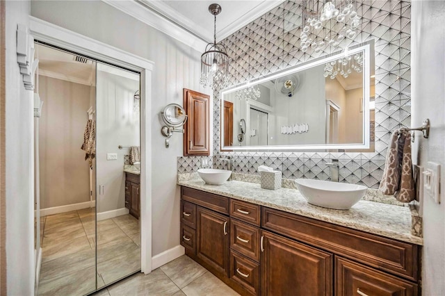 full bath featuring double vanity, backsplash, a sink, and crown molding