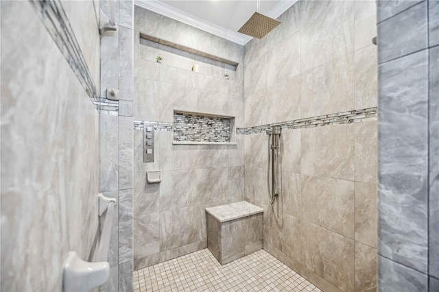 bathroom featuring tiled shower and crown molding