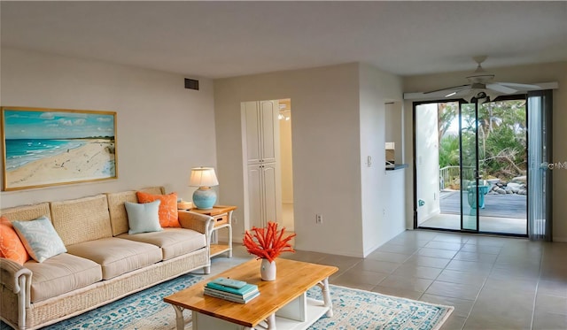 living room with tile patterned floors and ceiling fan