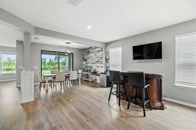 dining area with light hardwood / wood-style flooring