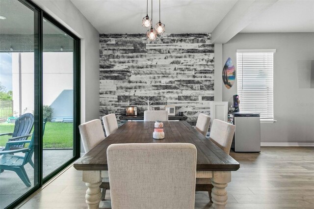 dining area featuring hardwood / wood-style flooring and a chandelier