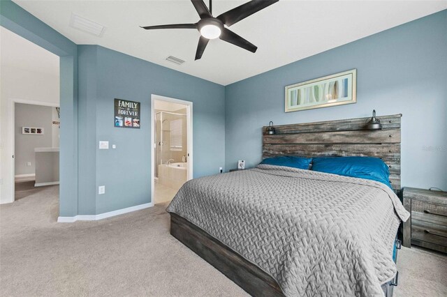 carpeted bedroom featuring connected bathroom and ceiling fan