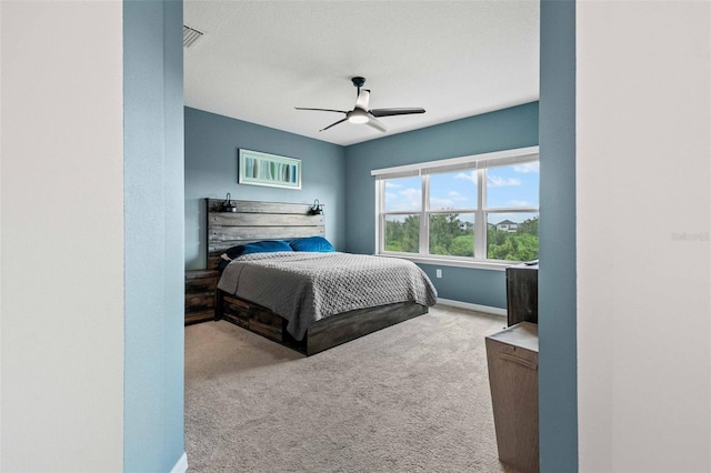 bedroom with ceiling fan and carpet floors