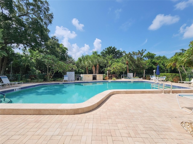 view of pool featuring a patio area