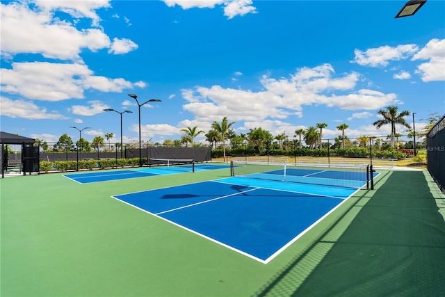 view of tennis court featuring basketball court