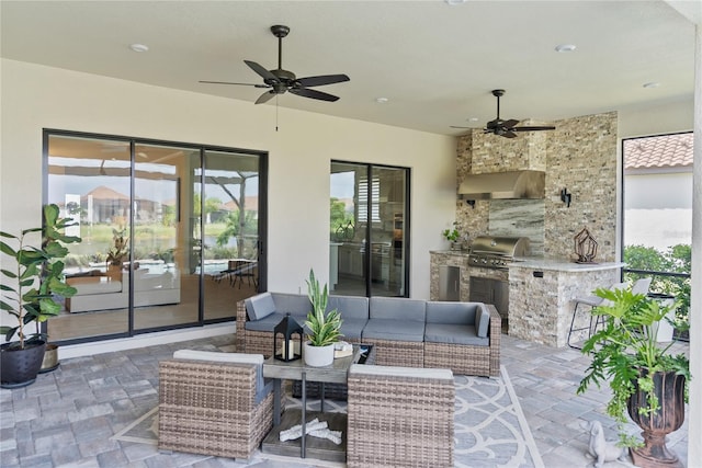 view of patio featuring an outdoor kitchen, ceiling fan, an outdoor hangout area, and grilling area