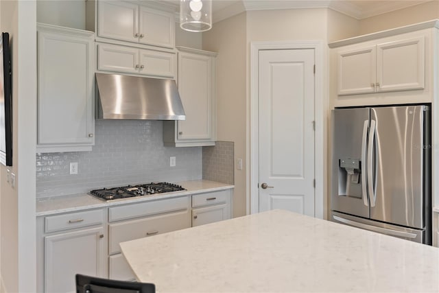 kitchen with white cabinets, extractor fan, backsplash, and appliances with stainless steel finishes