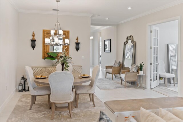 tiled dining space featuring crown molding, plenty of natural light, and a chandelier