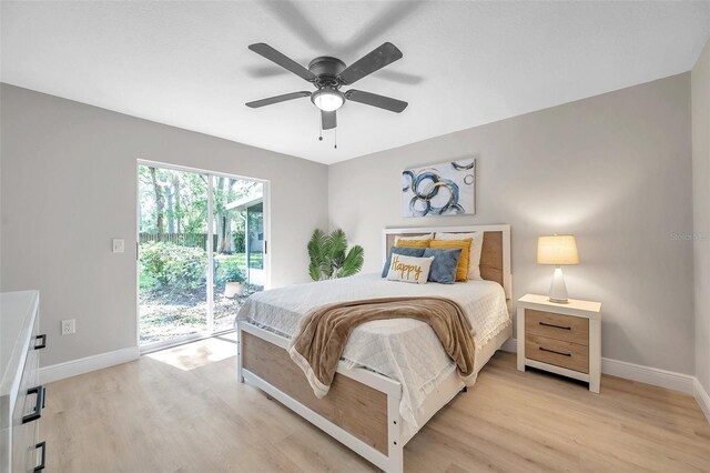 bedroom with ceiling fan, light wood-type flooring, and access to exterior