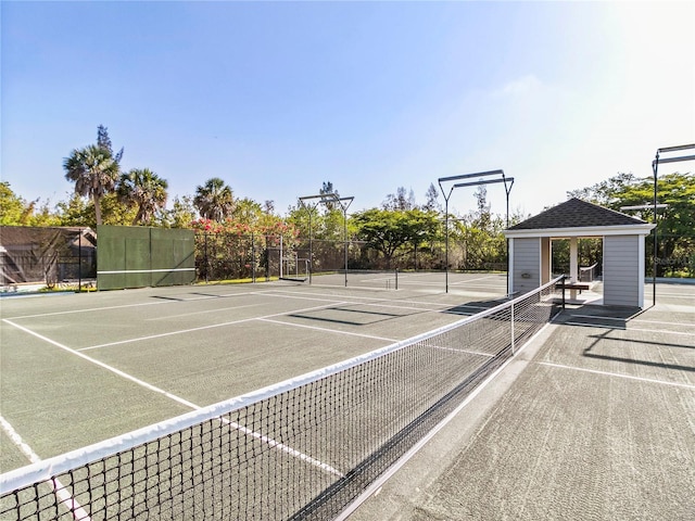 view of tennis court with fence