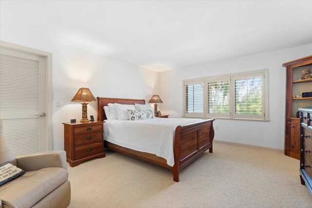 bedroom with light colored carpet