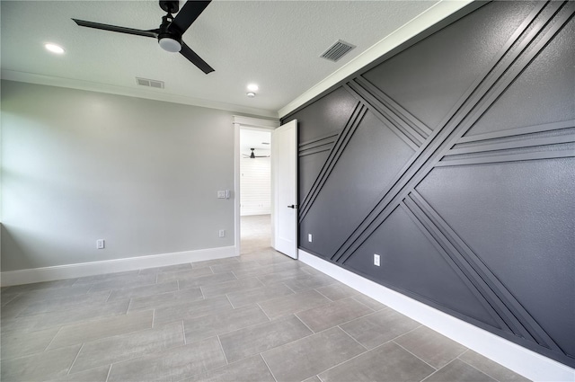 tiled spare room featuring ceiling fan