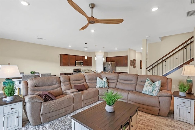 living room featuring ceiling fan