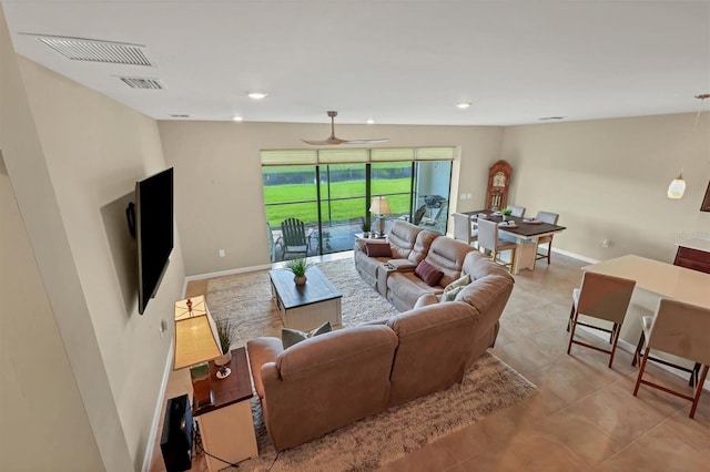 tiled living room featuring ceiling fan