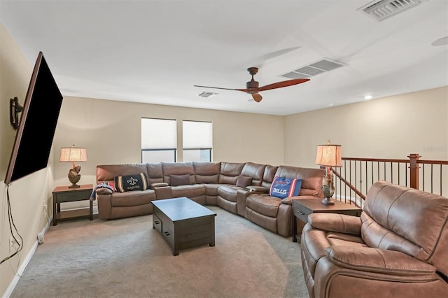 living room with ceiling fan and light carpet