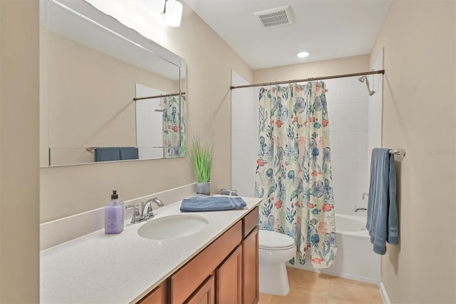 full bathroom featuring tile patterned flooring, shower / bath combination with curtain, vanity, and toilet