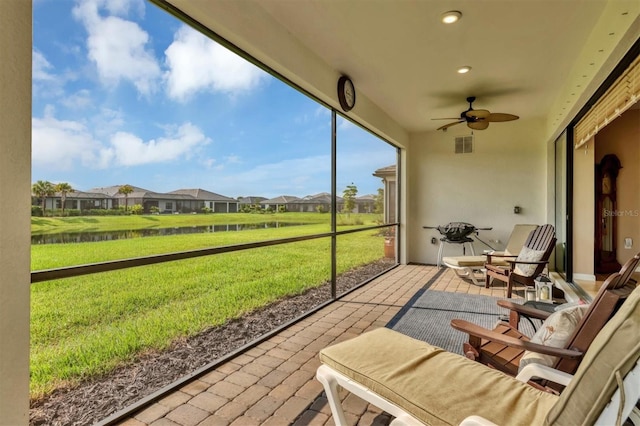 sunroom / solarium with ceiling fan